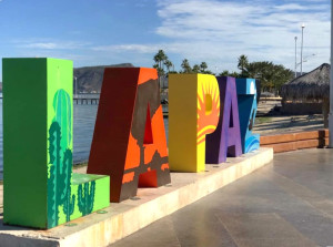 The La Paz city letters in bright colours on the Malecon boardwalk