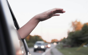 Left arm sticking out car window