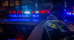 close up of flashing police lights on car at night